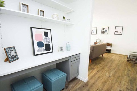 a living room with a shelf and a couch